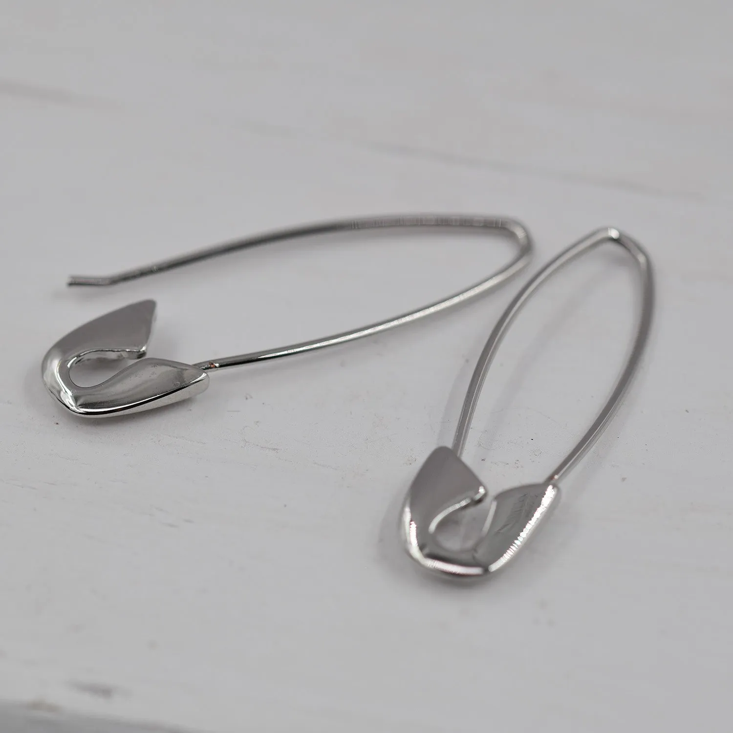 Delicate safety pin style earrings